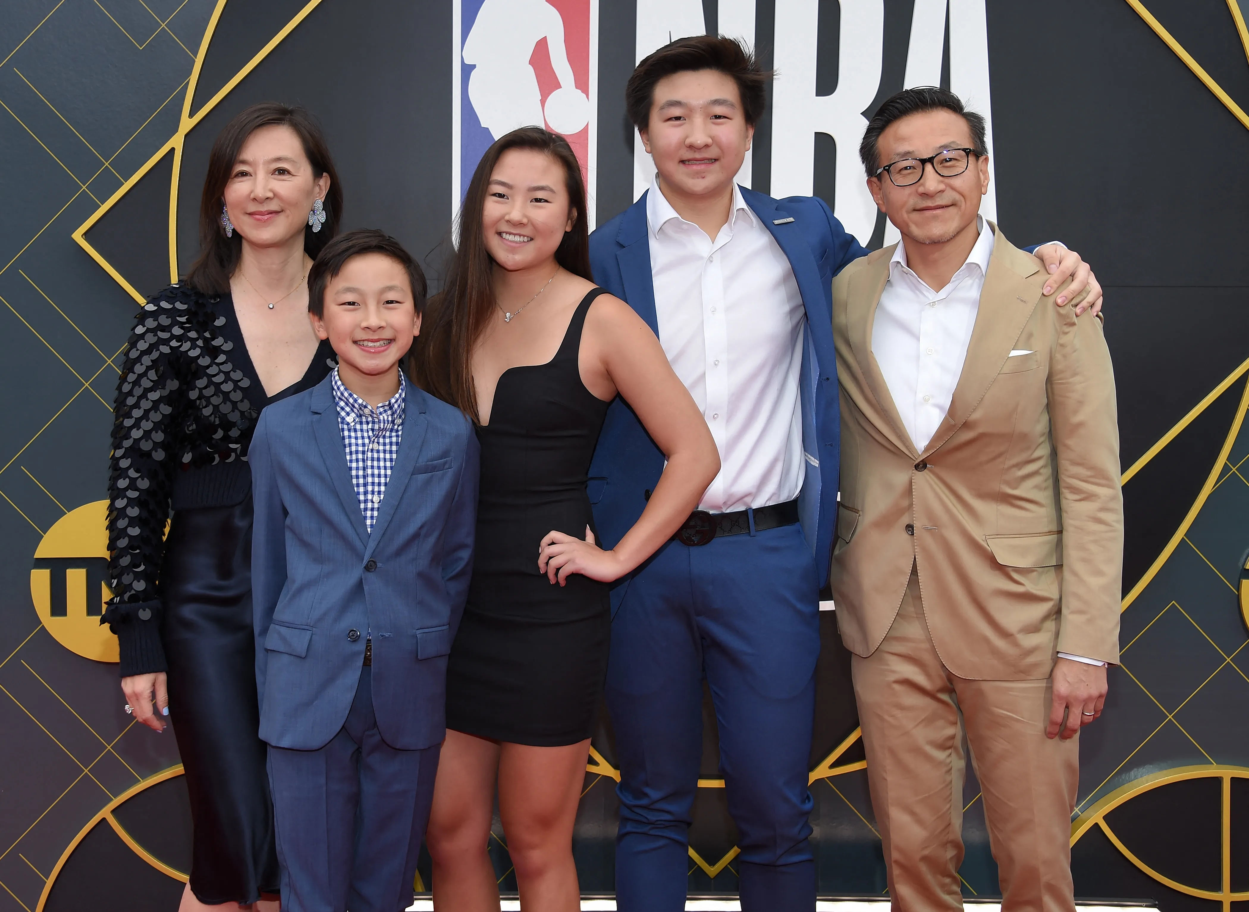 Clara Wu, Joe Tsai, and their children, Dash, Jacob, and Alex Tsai, pose at the 2019 NBA Awards.