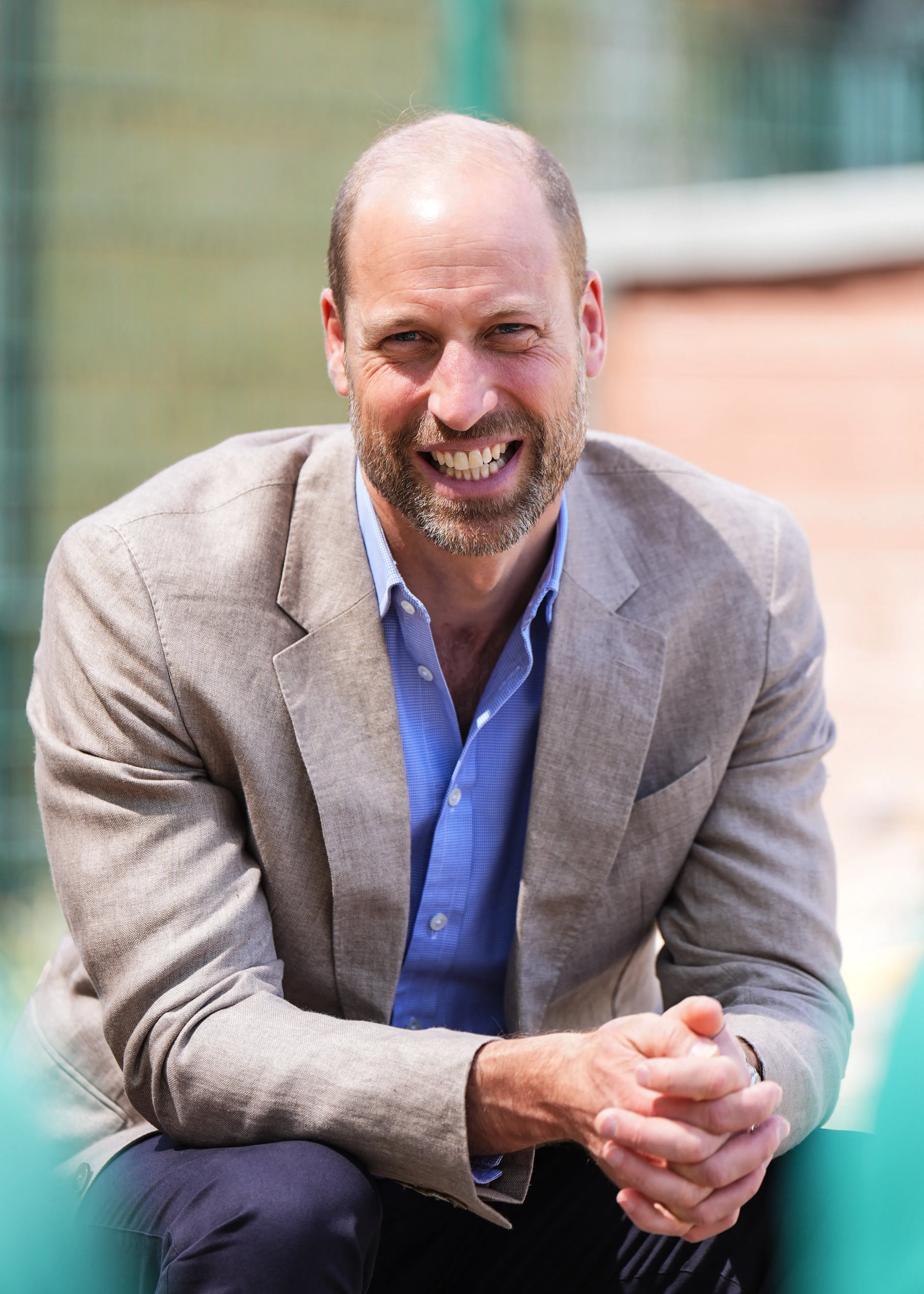 Prince William smiling at Ysgol Gymraeg Llundain.