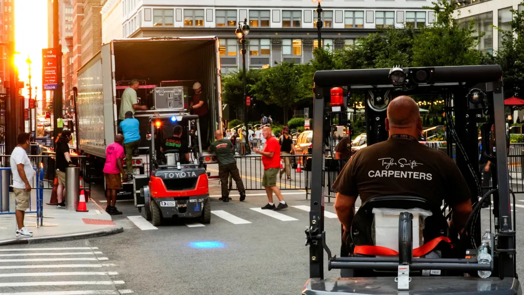 Workers unload equipment from a truck at Madison Square Garden.