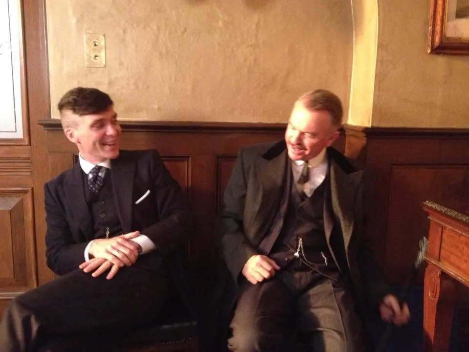 Cillian Murphy and Sam Neill smiling.