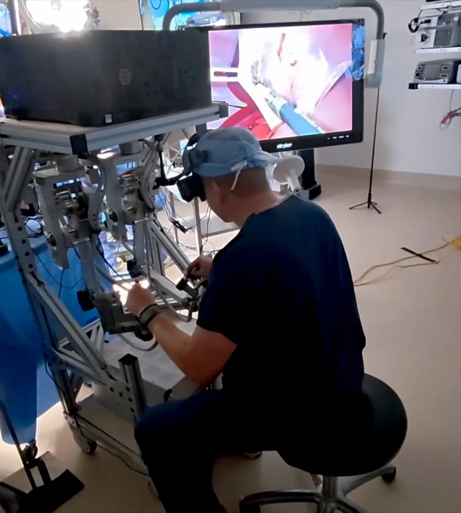 Surgeon operating humanoid robots during a virtual surgery.