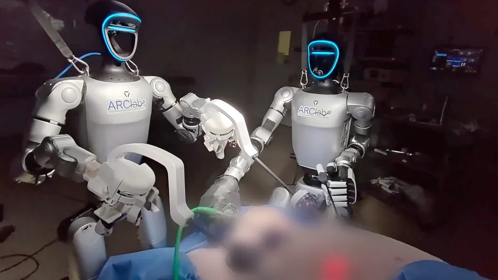 Two ARC Lab humanoid robots performing surgery on a patient.