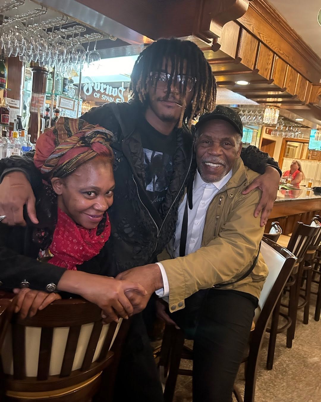 Danny Golber with his daughter and another person in a bar.