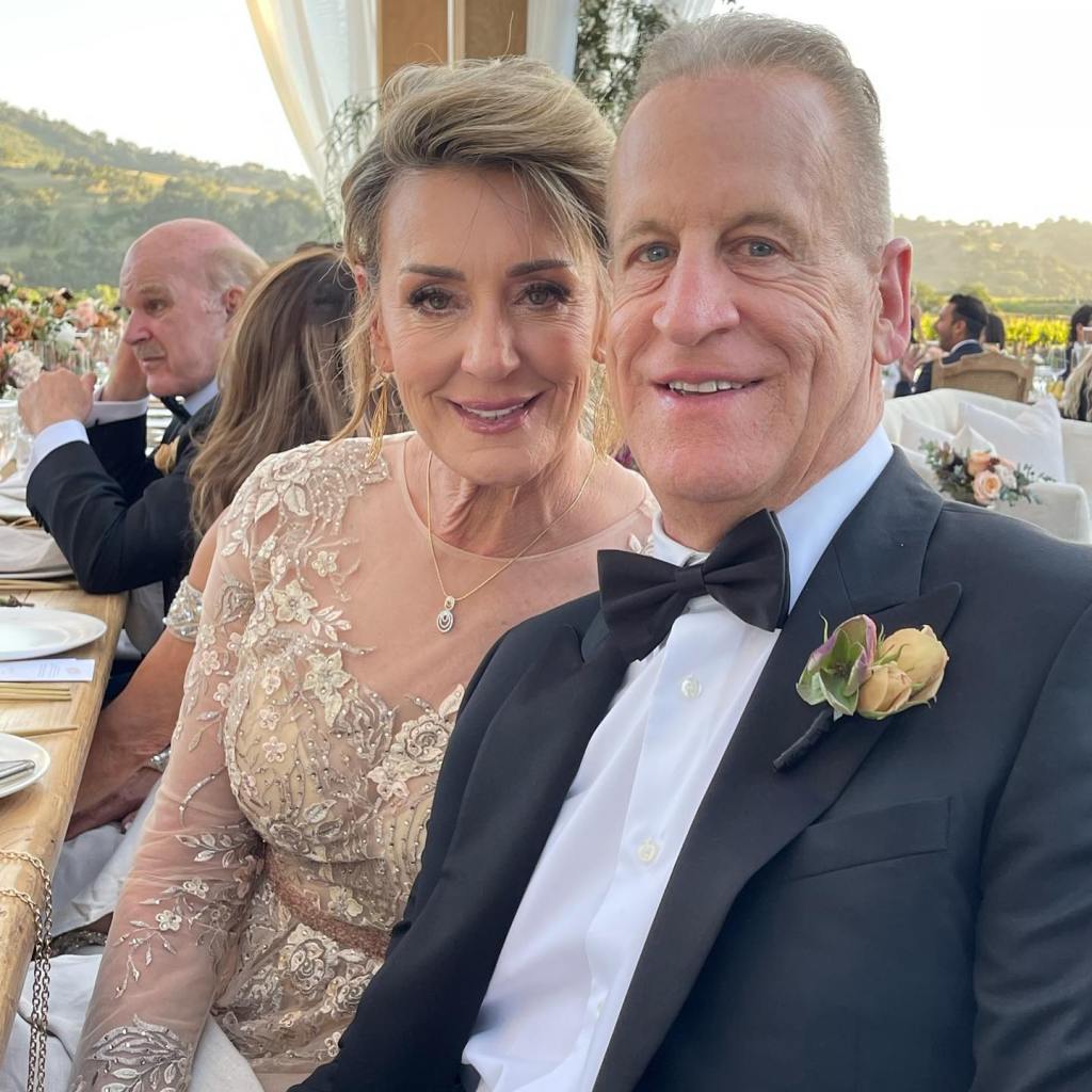 Aaron Rodgers' parents posing at their son's wedding.