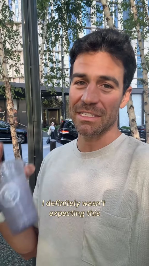 Joe Amabile filming himself on a city street.