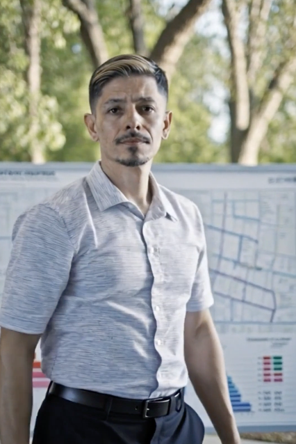 Rene Campos wearing a light blue short-sleeved shirt and dark pants.