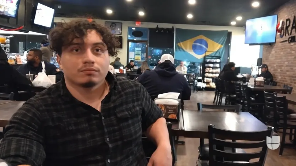 Jonathan Vargas, a victim of the Ohio River tragedy, sitting at a table in a restaurant.