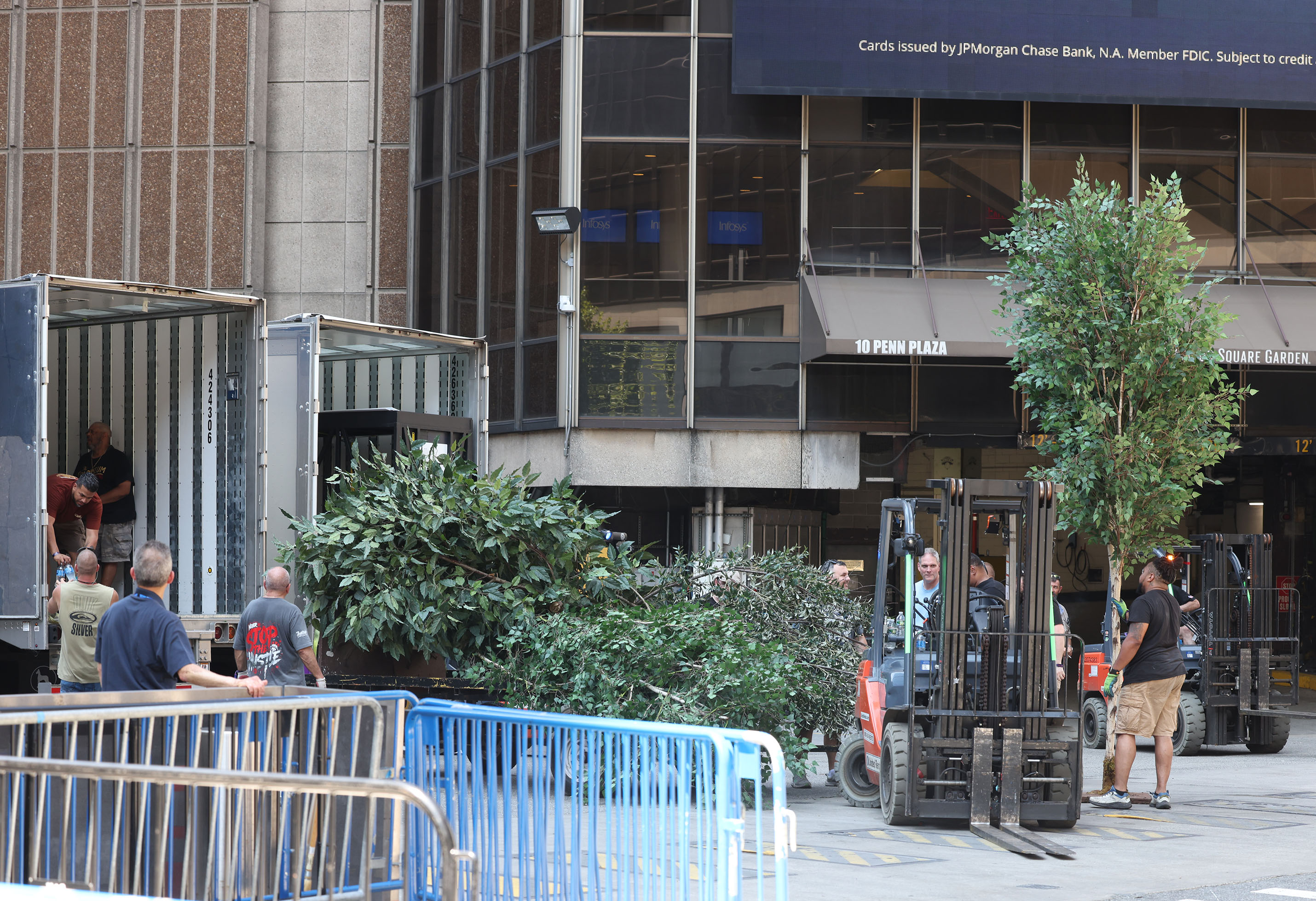 Trucks loading wedding equipment near Madison Square Garden.