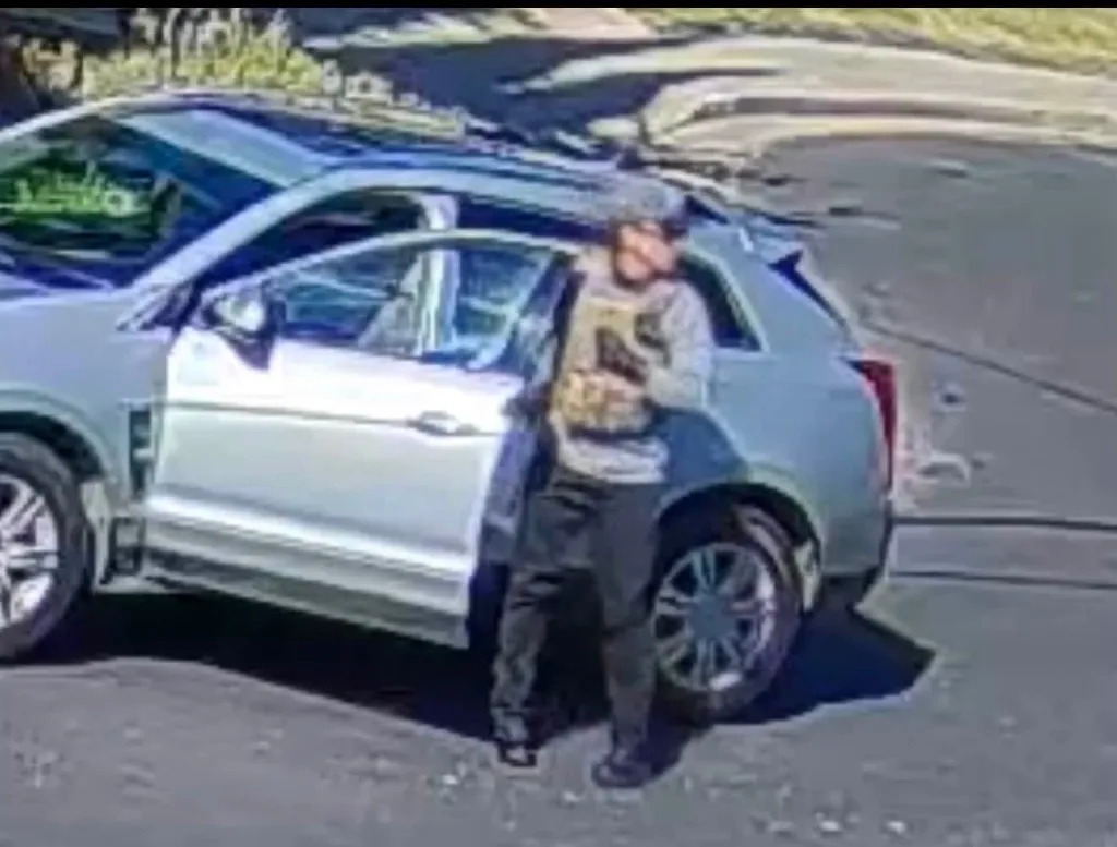 Marcos Iriarte-Valdez exiting a silver SUV.