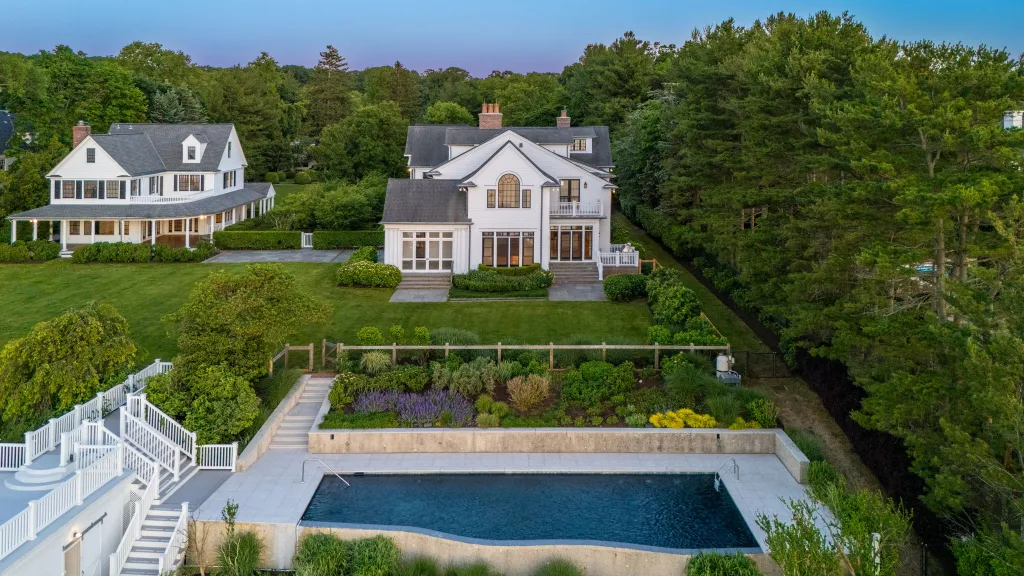 A waterfront compound with four residences on the Navesink River just listed for $26 million, which could set a new record for the town if it closes near ask.