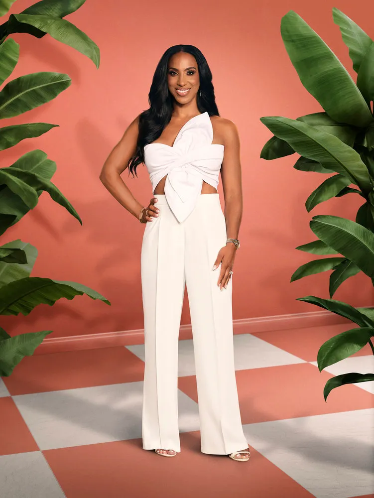 Annemarie Wiley posing in a white top and pants.
