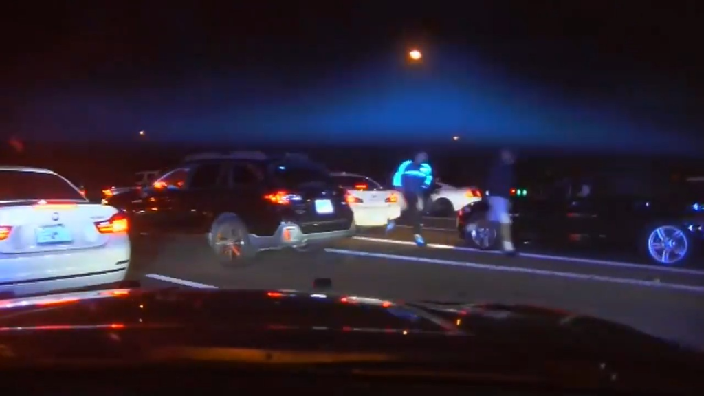 Dashcam footage showed hundreds of vehicles stopped on Interstate 75 during a street takeover before a Florida Highway Patrol trooper pursued a fleeing BMW