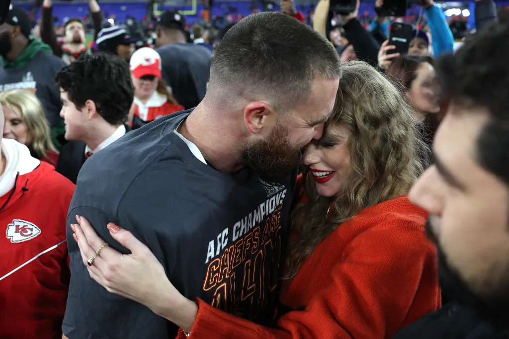 Travis Kelce embracing Taylor Swift after a Kansas City Chiefs victory.