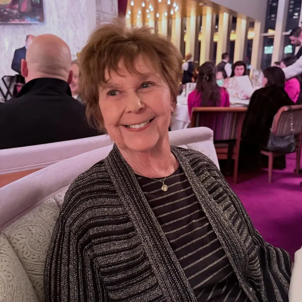 Nancy Guthrie smiling in a restaurant.