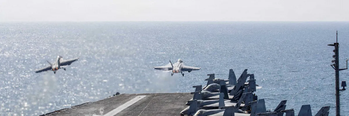 Sailors reportedly hurl themselves overboard the USS Abraham Lincoln