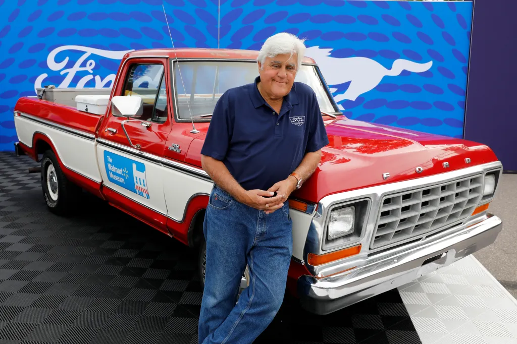 Jay Leno in front of a 1979 Ford F-150 pickup.