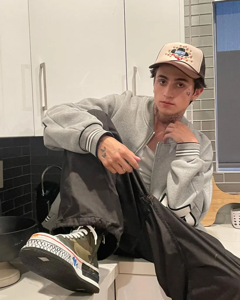 TikTok star Cooper Noriega sitting on a countertop.