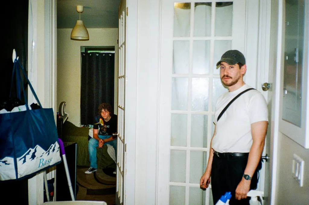 Kyle Harvey (left) and Joe Medina (right) in their Bushwick apartment.