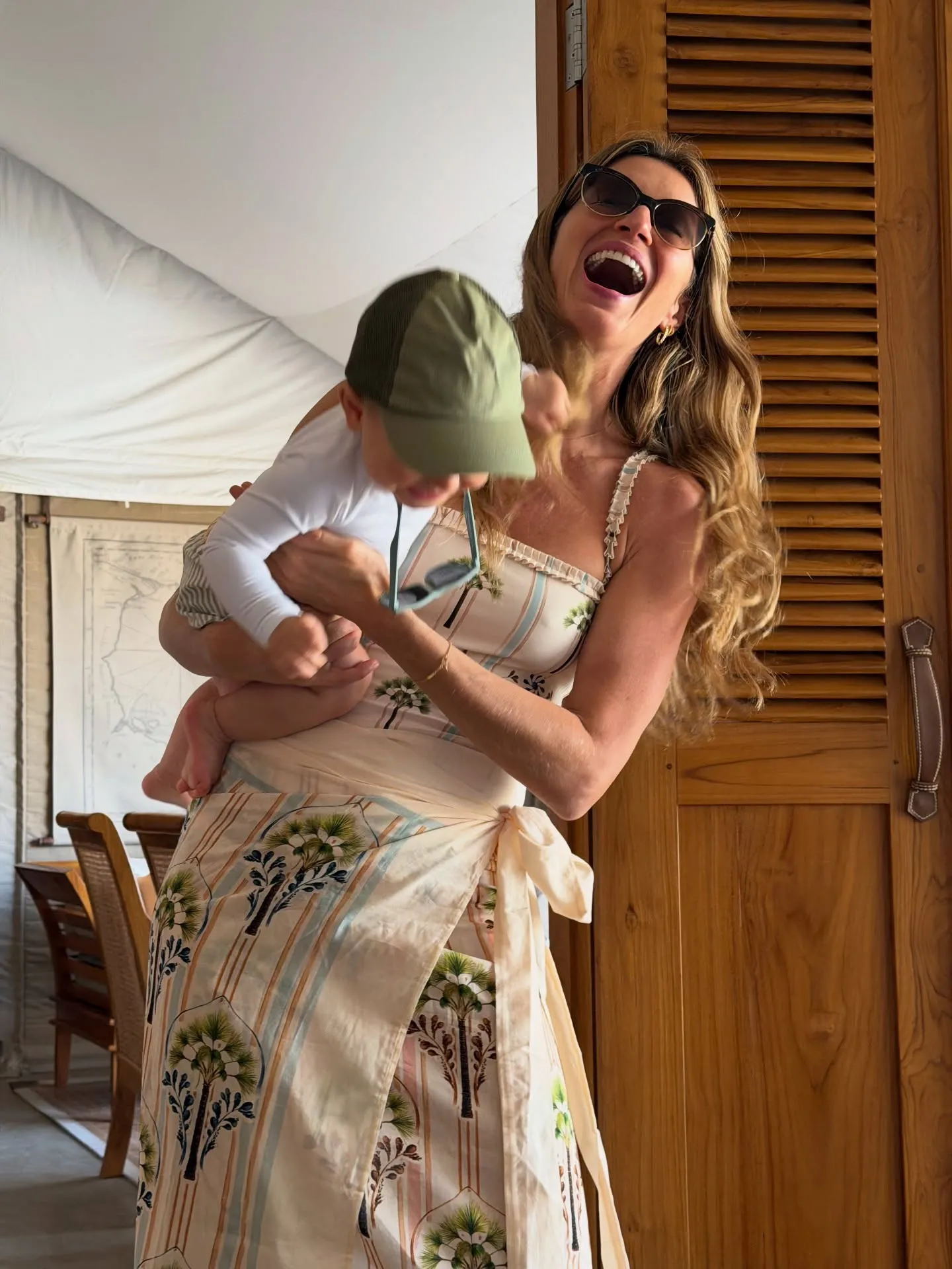 Gisele Bundchen holding her son.