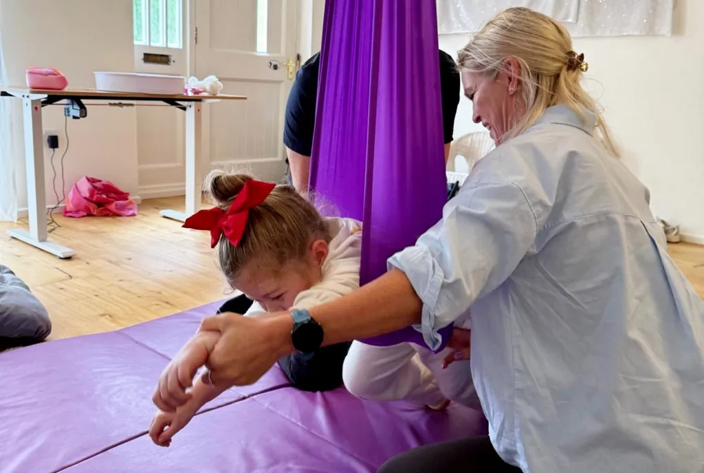 Olivia Elliot, a four-year-old girl, receiving physiotherapy.