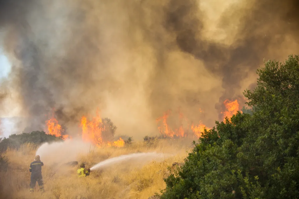 Firefighters battling a wildfire in the Megara Region, west of Athens.