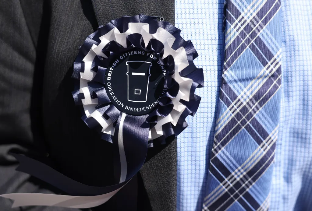 A supporter wears an election rosette in support of Count Binface on Saturday, August 8, 2026, in Clacton-on-Sea, Britain.