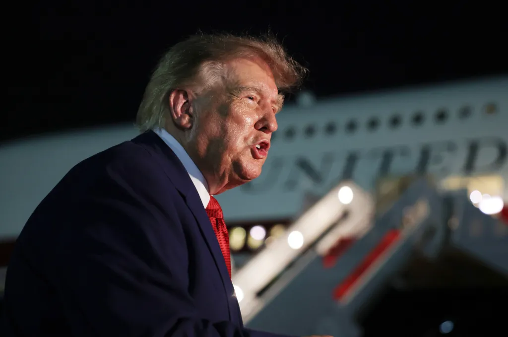 President Donald Trump speaks to reporters after stepping off Air Force One.