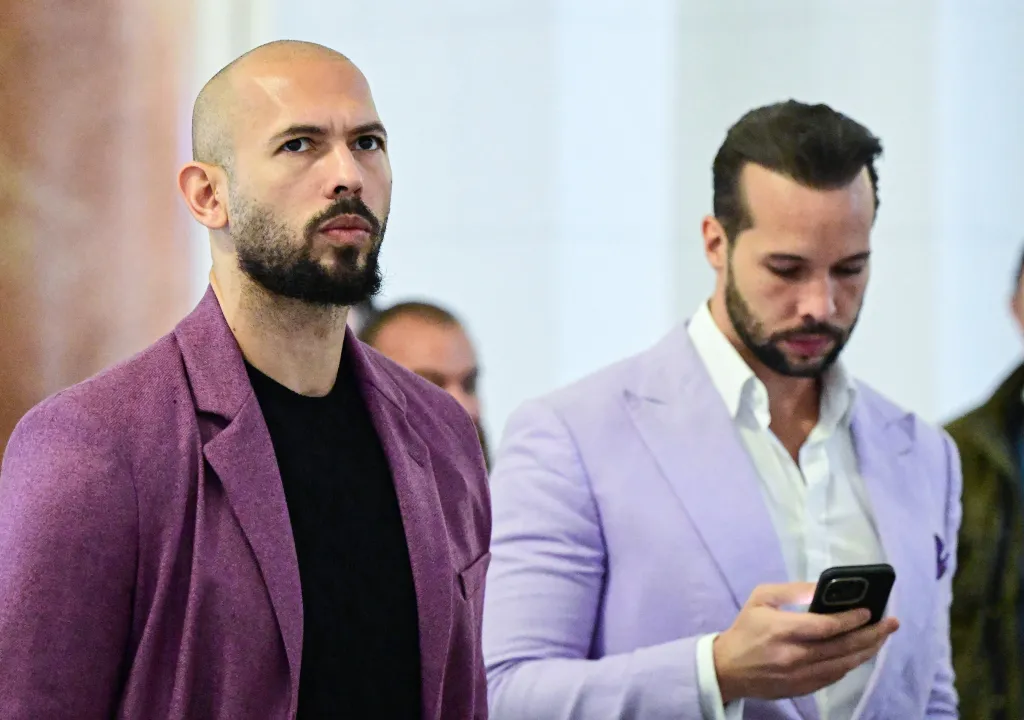 Andrew Tate, left, and his brother Tristan Tate are pictured inside The Court of Appeal in Bucharest, Romania, on Dec. 10, 2024.