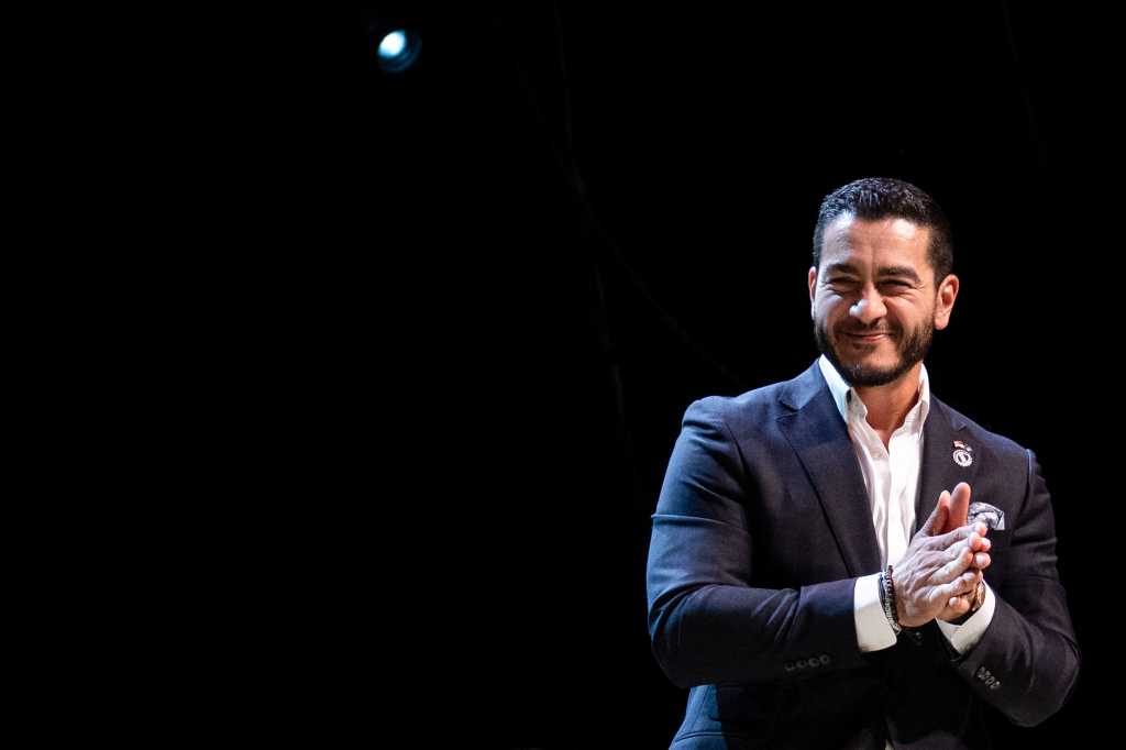 Abdul El-Sayed, US Democratic Senate candidate, smiles and claps at a primary election night watch party.