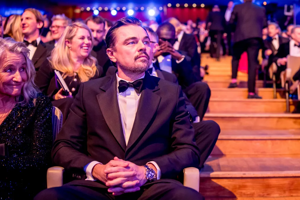 Leonardo DiCaprio sits in the audience at the EE BAFTA Film Awards 2026.