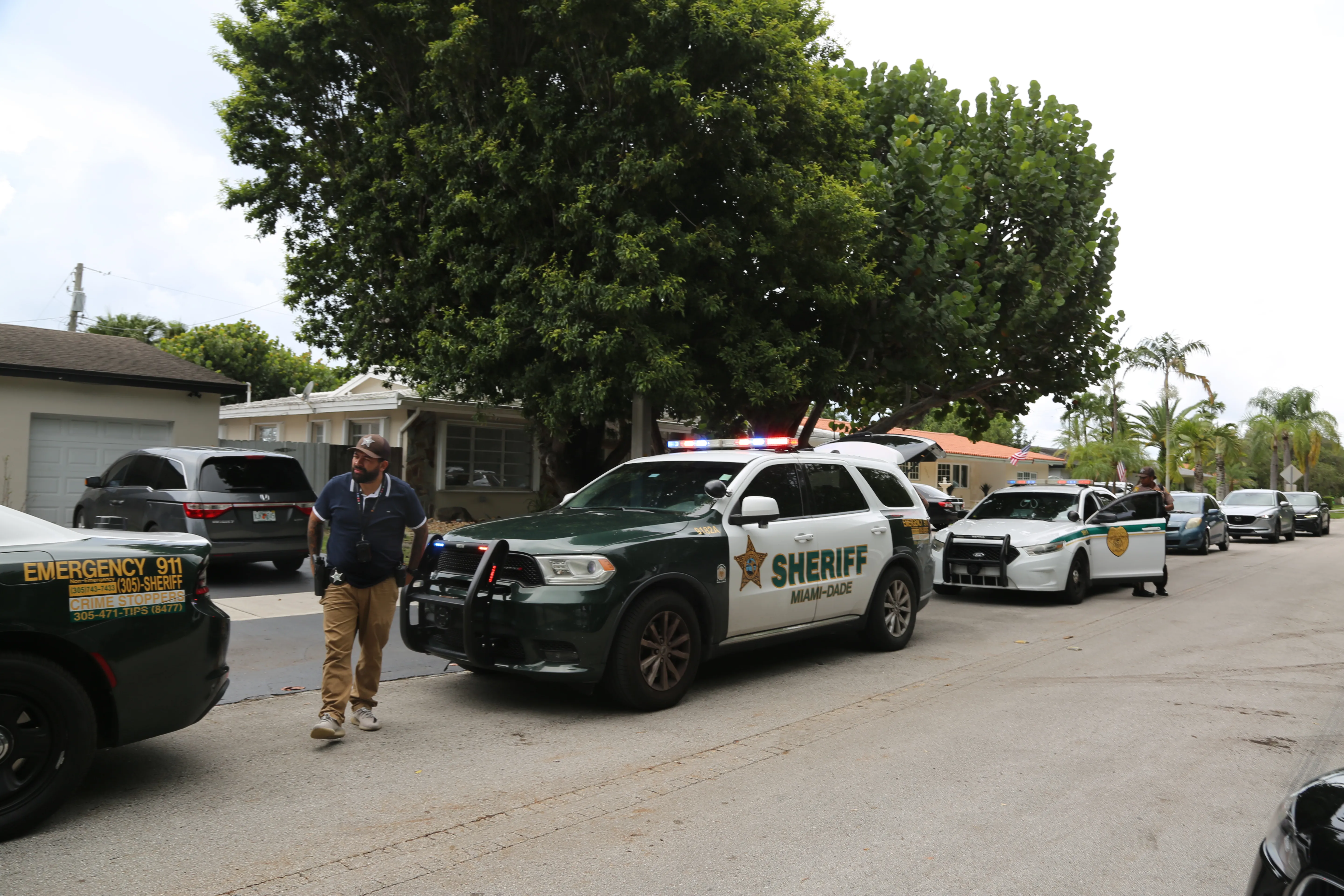 Sheriff's deputies arrive at Perez Hilton's home in Westchester, Florida.