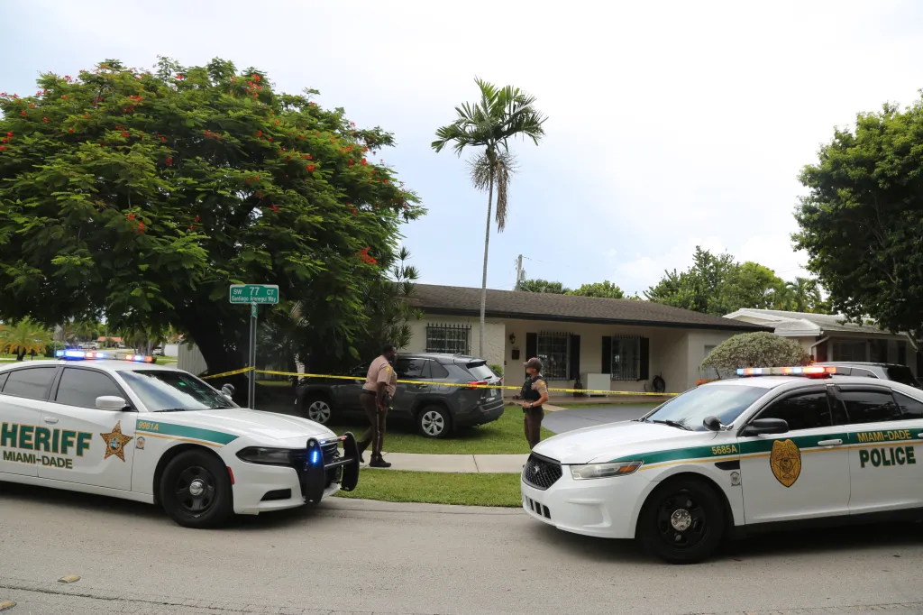 Police cars and officers gathered outside Perez Hilton's home in Westchester, Florida.