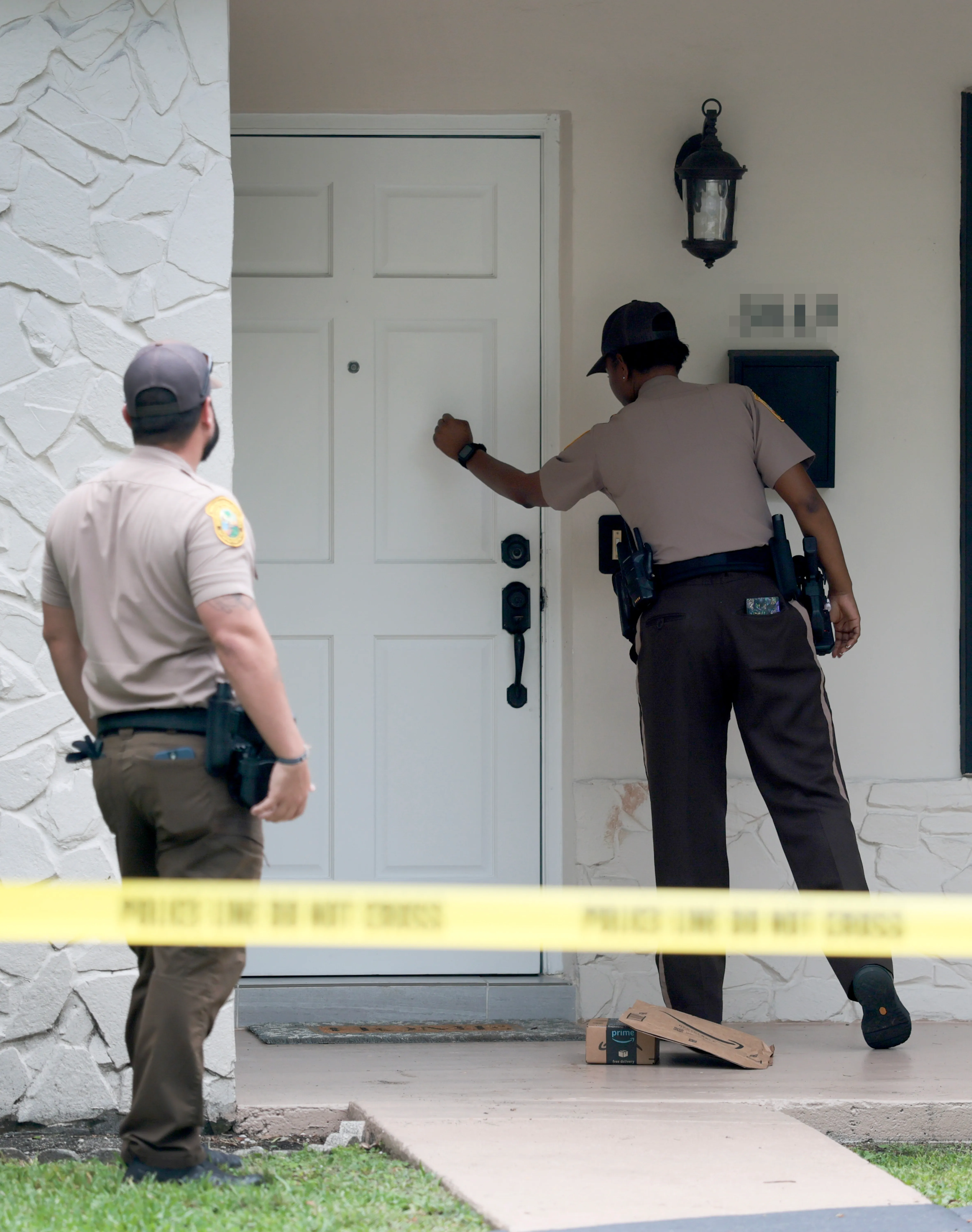 Police officers at Perez Hilton's Miami home after an incident involving a TikTok livestream.