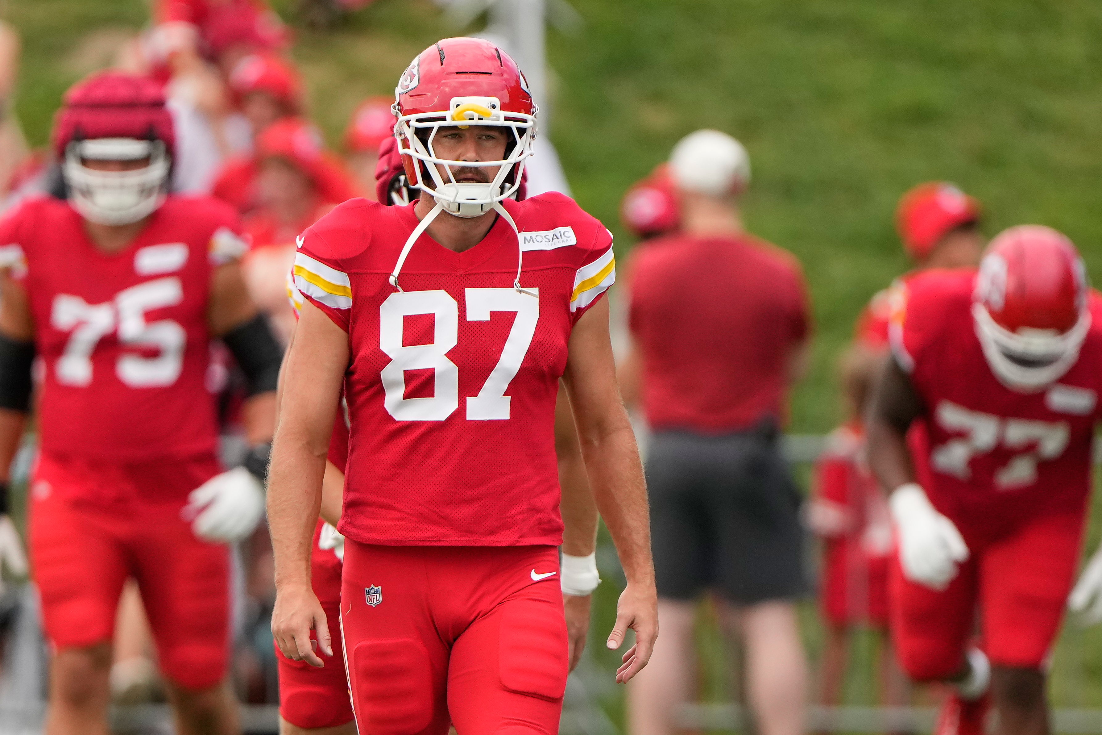 Kansas City Chiefs tight end Travis Kelce (87) stretches during training camp.