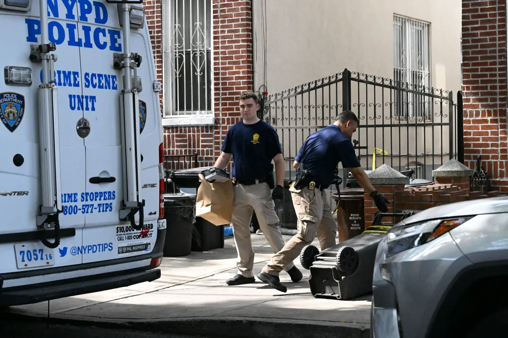 NYPD Crime Scene Unit investigators removing evidence from 1644 64th Street in Brooklyn.