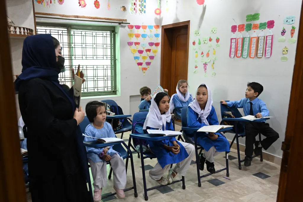 Afghan refugee children attend a class at Estiqlal Lycee High School in Islamabad on October 30, 2023.