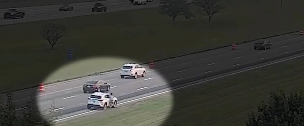 Traffic cameras capture vehicles in motion on a highway.