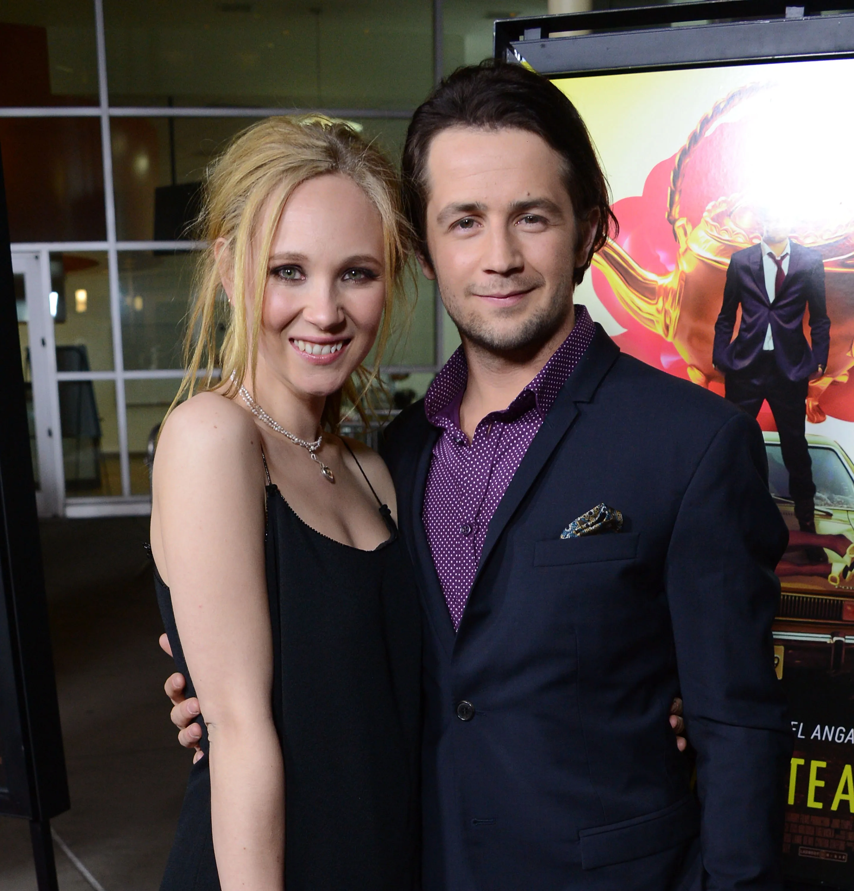 Actors Juno Temple and Michael Angarano posing for a photo.