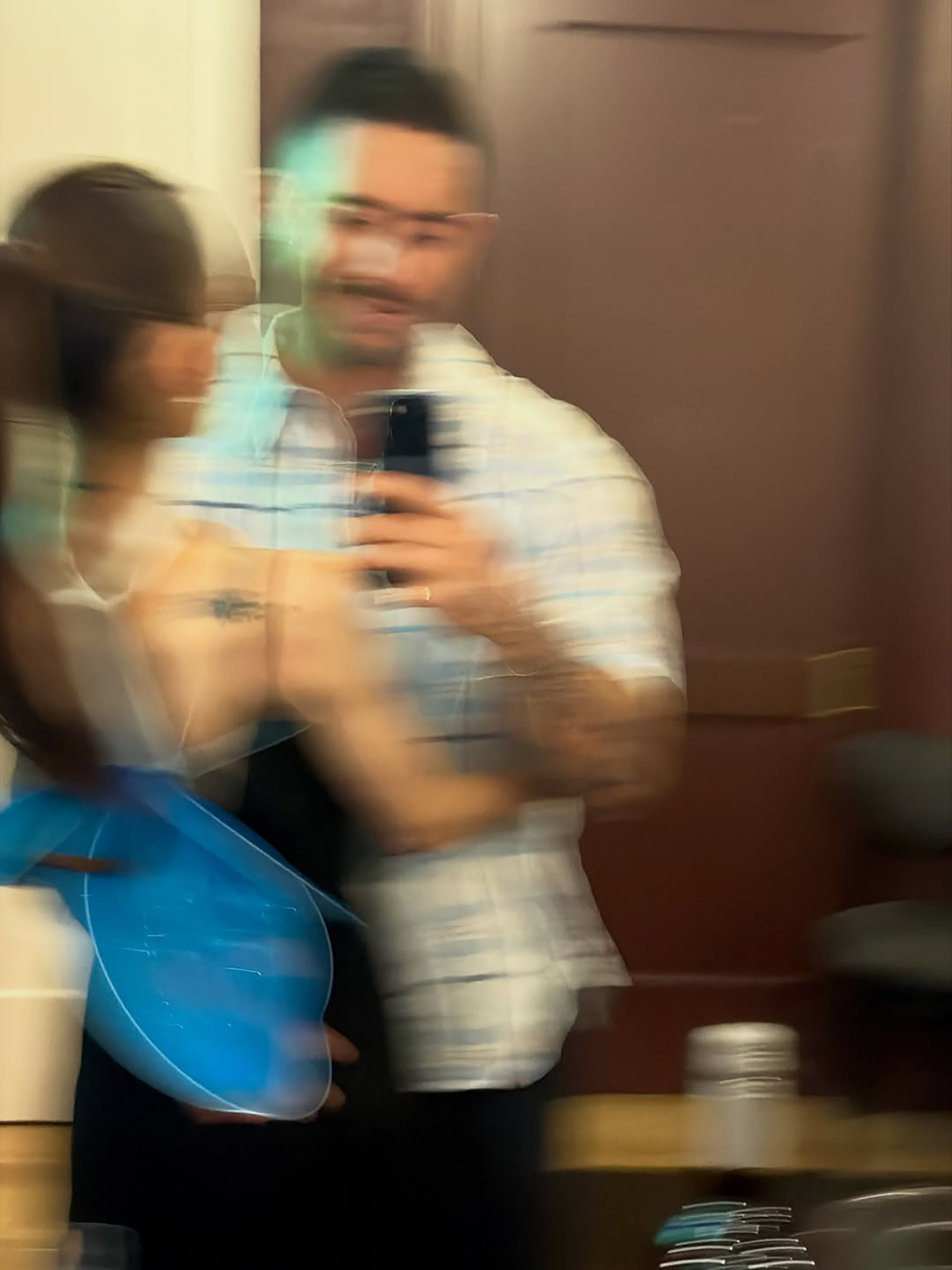 Ariana Grande and Ricky Alvarez in a blurry mirror selfie.