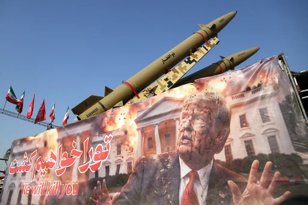 Banner depicting an injured Donald Trump and a burning White House, with text "We will kill you" in English and Persian, displayed with ballistic missiles.