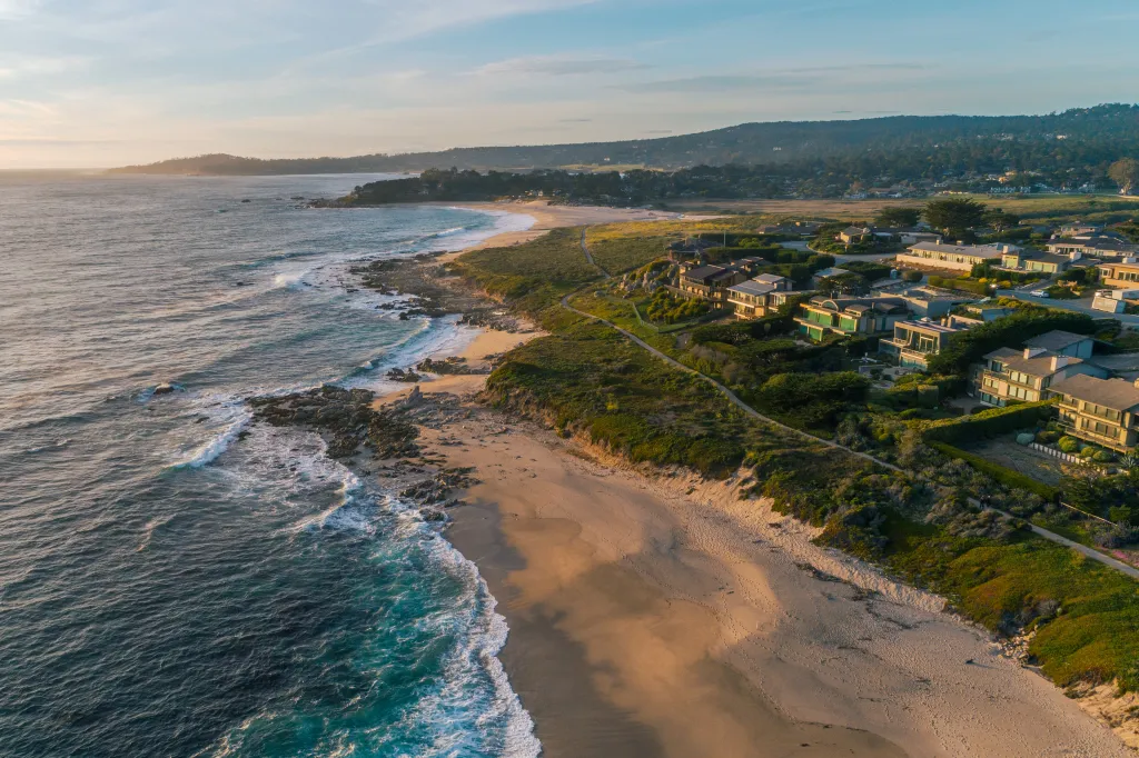 Aerial view of a beach with homes in Carmel, California.