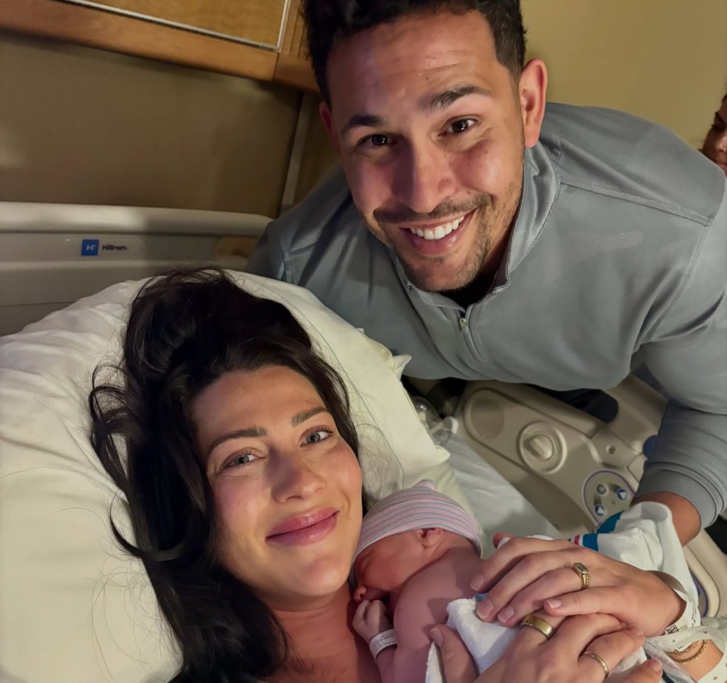 Becca Kufrin and Thomas Jacobs with their newborn baby, Steven Jon.