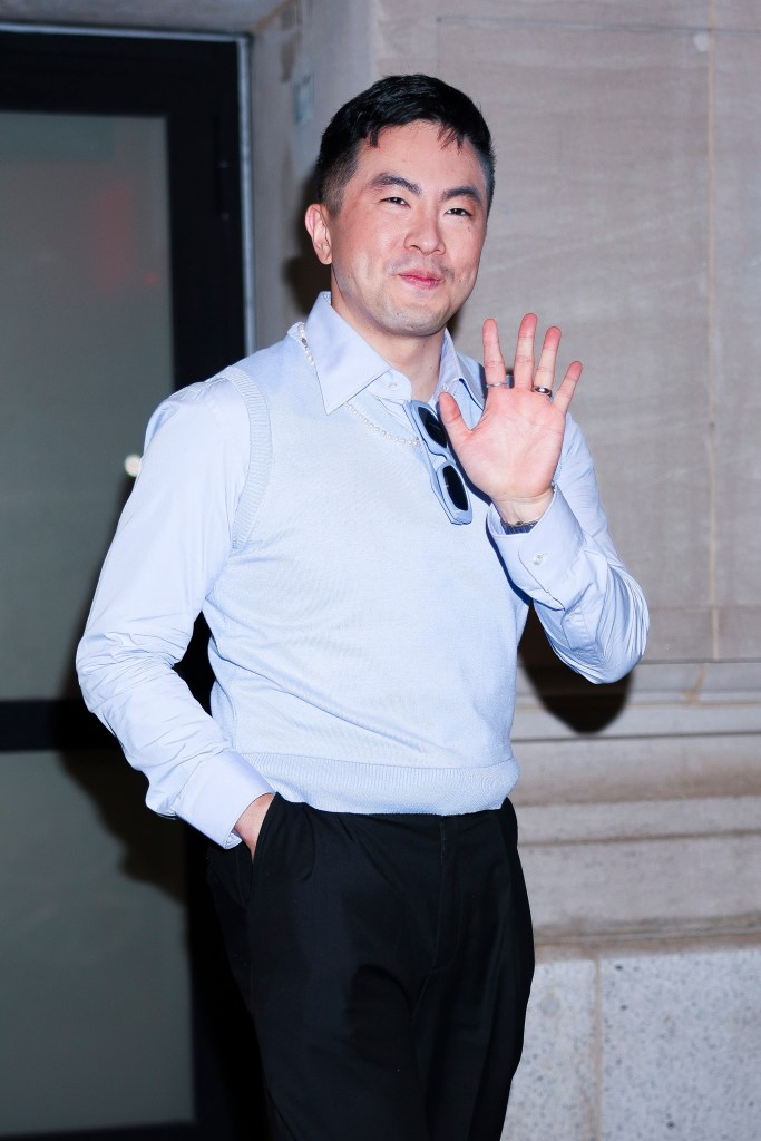 Bowen Yang waving to the camera.