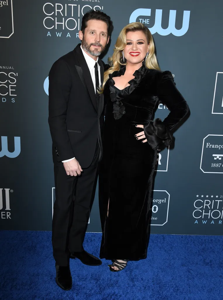 Brandon Blackstock and Kelly Clarkson pose at the 25th Annual Critics' Choice Awards.
