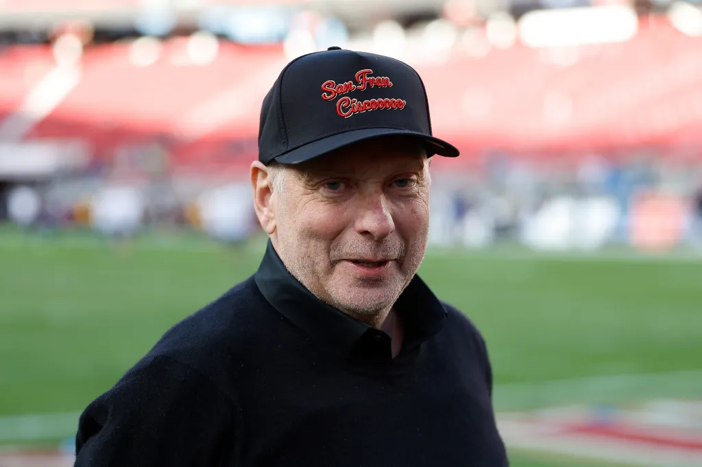 Broadcaster Greg Papa in a black "San Francisco" hat and black sweater.
