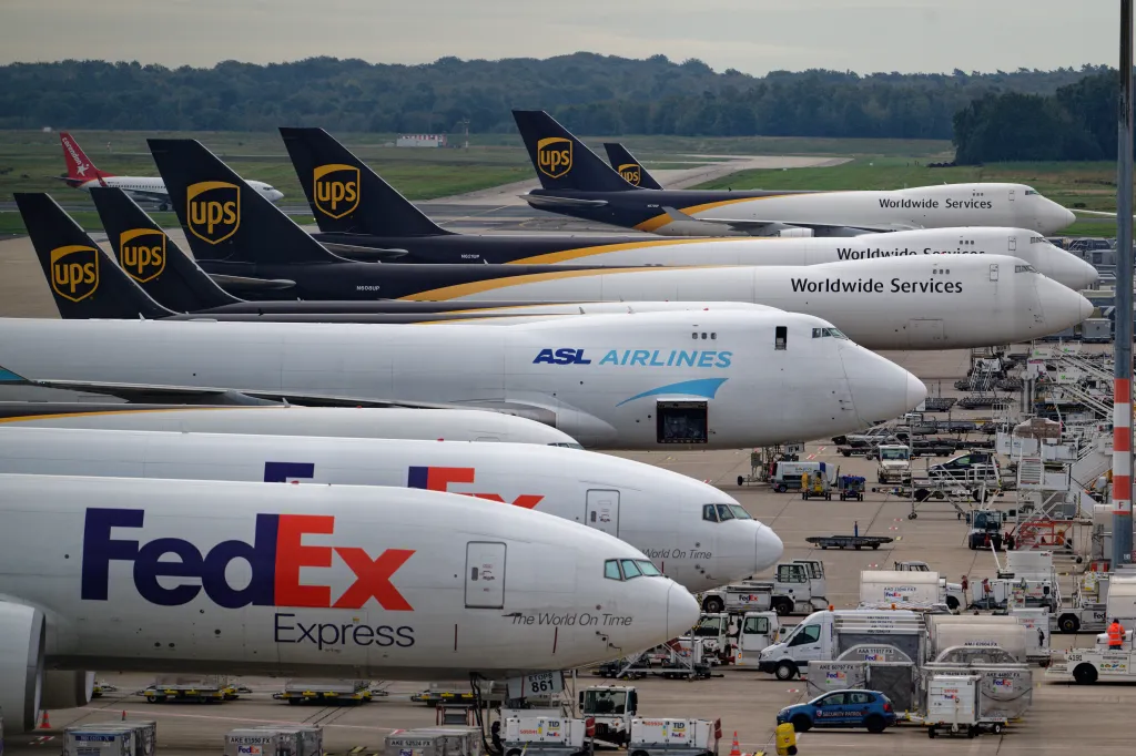 Cargo planes from UPS, ASL Airlines, and FedEx are parked at Cologne Bonn Airport.