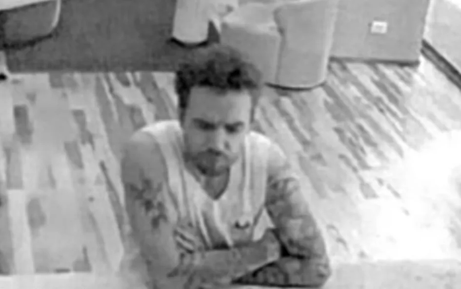 CCTV still of Liam Payne in a hotel room.