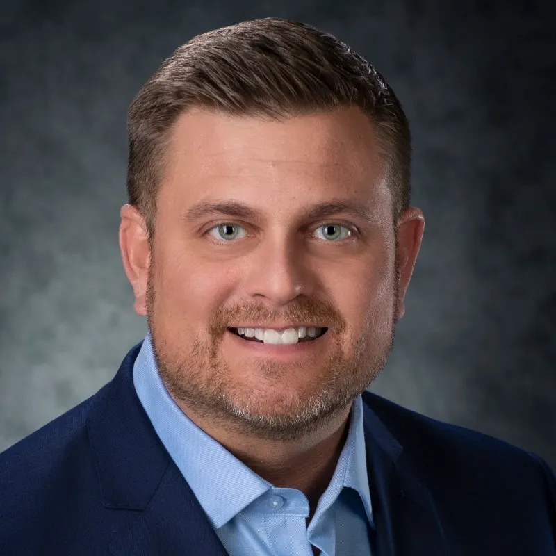 Headshot of Brian Thompson, CEO of UnitedHealth's insurance division.