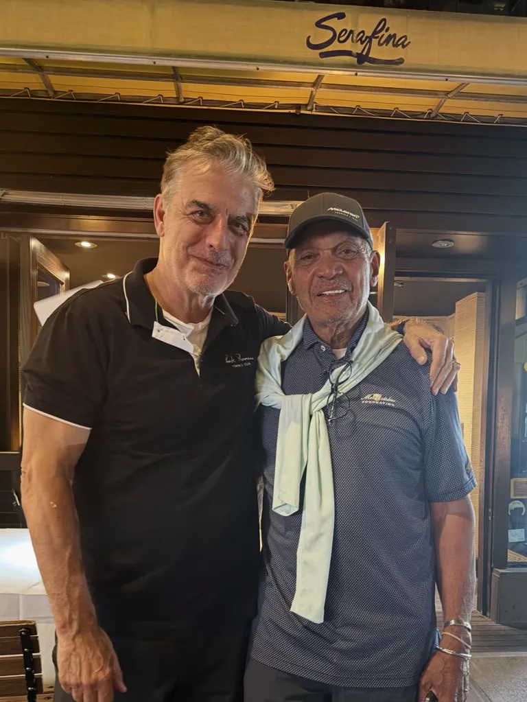 Chris Noth and Reggie Jackson smiling for a photo together.