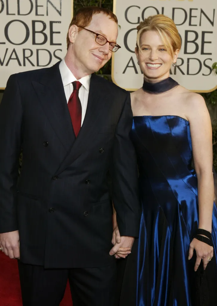 Composer Danny Elfman and actress Bridget Fonda holding hands at the 61st Annual Golden Globe Awards.